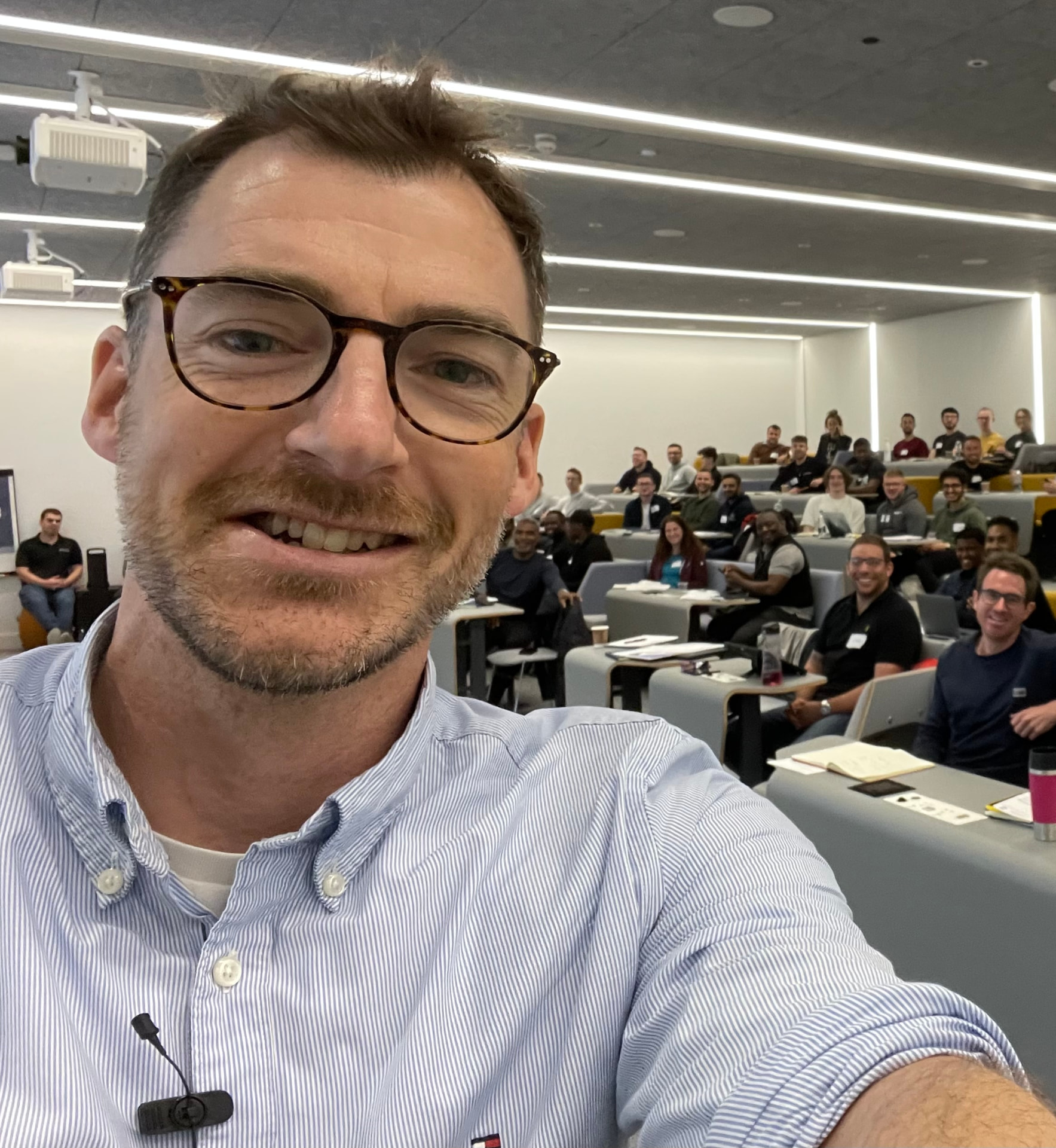Dr Ryan King leading a workshop with an audience in a lecture hall